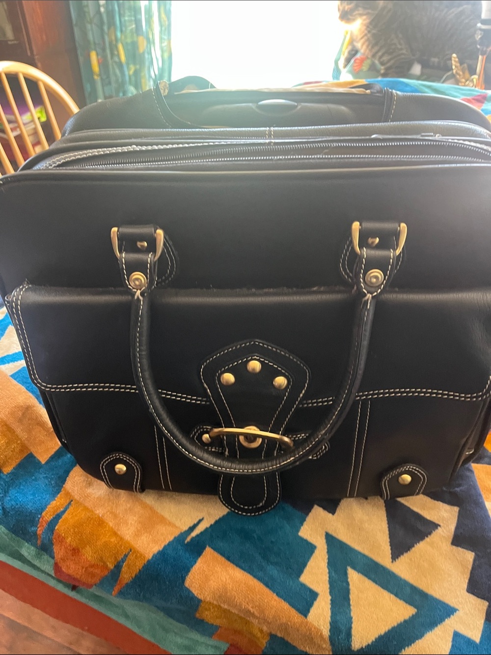 Franklin Covey black leather rolling bag. In great condition